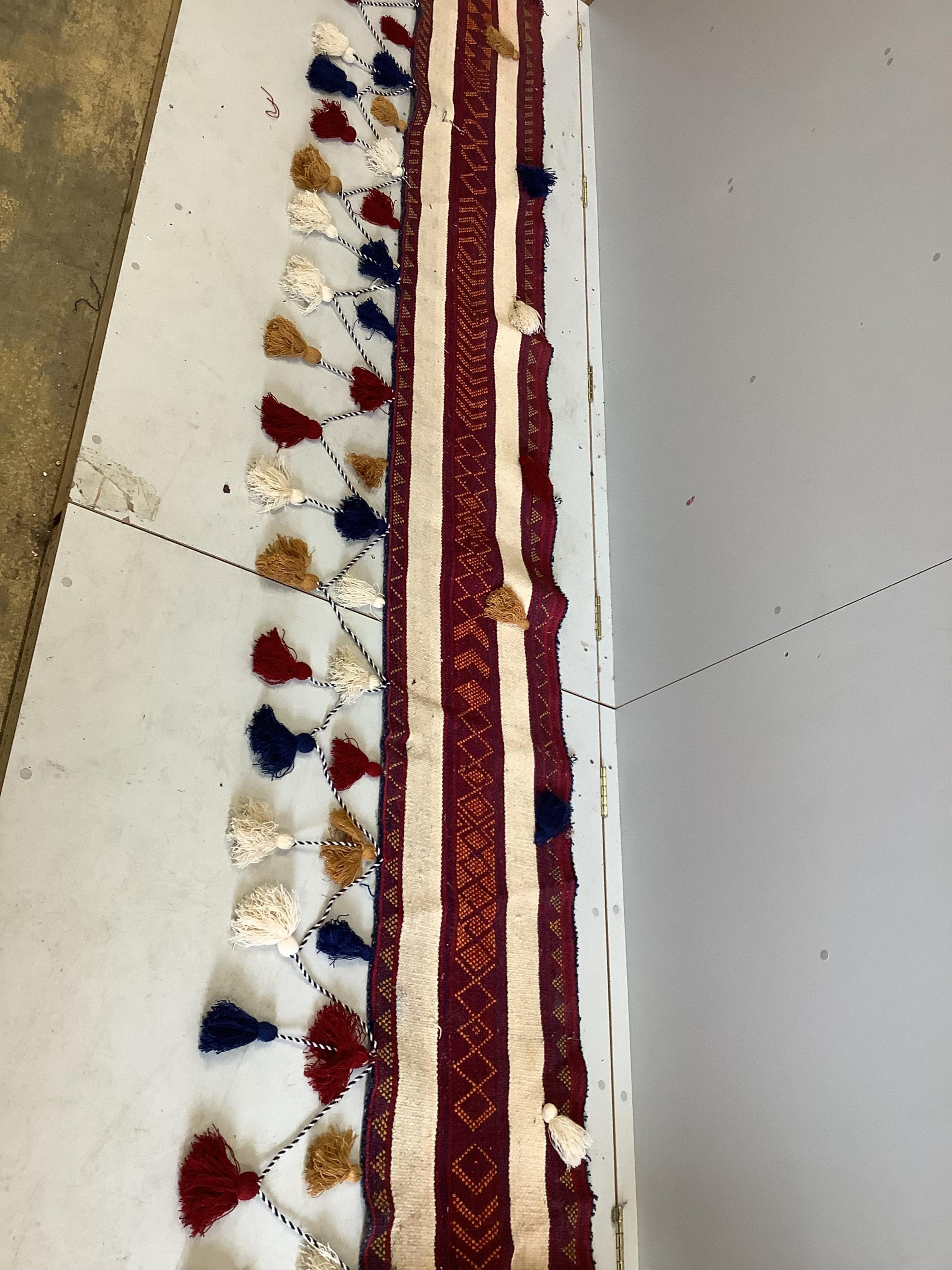 An Anatolian fringed wall hanging, 360 x 73cm. Condition - good